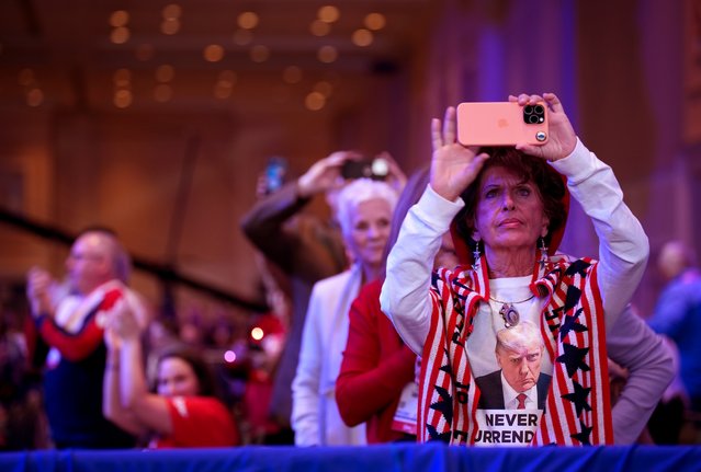 Attendees take photos at the Conservative Political Action Conference (CPAC) at the Gaylord National Resort Hotel And Convention Center on February 20, 2025 in Oxon Hill, Maryland. The annual four-day gathering brings together conservative U.S. lawmakers, international leaders, media personalities and businessmen to discuss and champion conservative ideas. (Photo by Andrew Harnik/Getty Images)