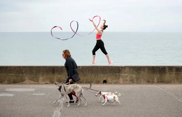 Team GB Rhythmic Gymnast Lynne Karina Hutchison during a training session on the seafront in Hove, following the outbreak of the coronavirus disease (COVID-19), Hove, Britain, June 10, 2020. (Photo by Peter Cziborra/Reuters)