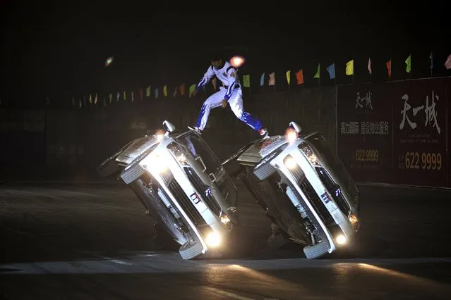 Stunt drivers perform during a drift game in Taiyuan, Shanxi province, China, September 14, 2015. (Photo by Reuters/Stringer)