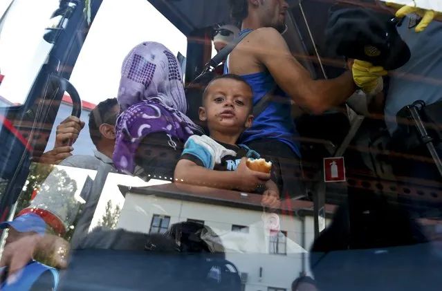 A migrant child looks out of a bus at the station in Beli Manastir, Croatia September 18, 2015. (Photo by Laszlo Balogh/Reuters)