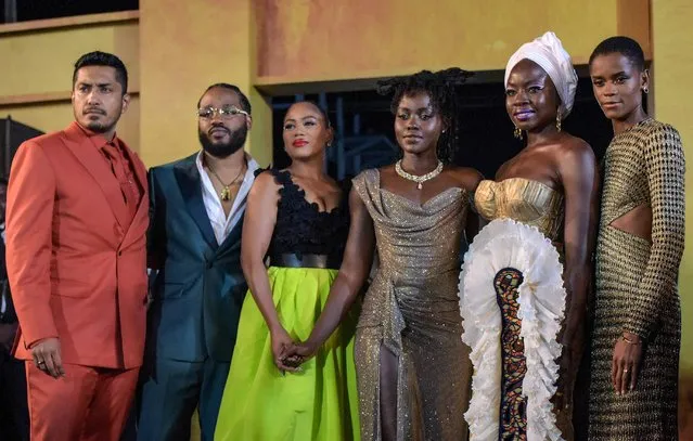 (L-R) Mexican actor Tenoch Huerta, US director Ryan Coogler and hi wife Zinzi Evans, Kenyan actor Lupita Nyong'o, US actor Danai Gurira, and Guyanese actor Letitia Wright arrive for the African premiere of the film “Black Panther: Wakanda Forever” in Lagos, on November 6, 2022. The African premiere of the Marvel superhero film “Black Panther: Wakanda Forever” is taking place in Lagos, a leading commercial hub for African entertainment ahead of the film's global release on November 11. (Photo by Pius Utomi Ekpei/AFP Photo)