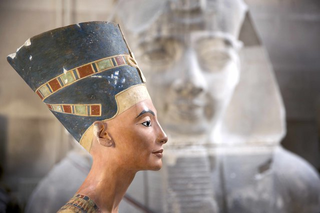 A replica of the bust of Nefertiti stands in the Replica Workshop of the National Museum of Berlin in Berlin, October 2, 2015. The workshop plans to produce 10 to 20 replicas a year, which like the original are made of a limestone core with gypsum finish. Each one will cost  8,900 euros (9,934 US Dollars). (Photo by Axel Schmidt/Reuters)