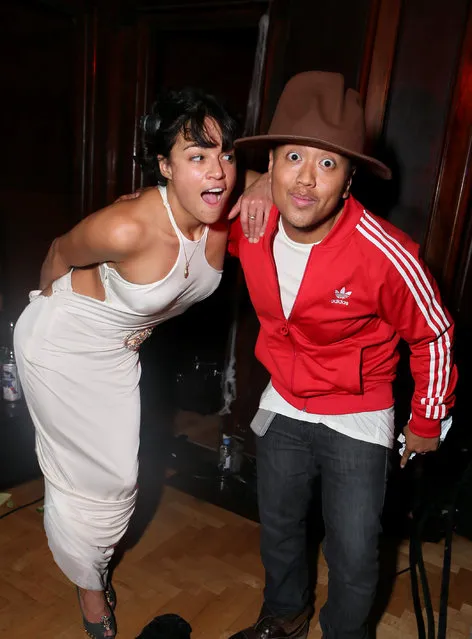 Michelle Rodriguez, left, and Rembrandt Flores attend Treats! Halloween with Absolut Elyx in partnership with Utsinger Entertainment at the Los Angeles Theatre on Friday October 31, 2014 in Los Angeles, Calif. (Photo by Alexandra Wyman/Invision for Treats Magazine/AP Images)