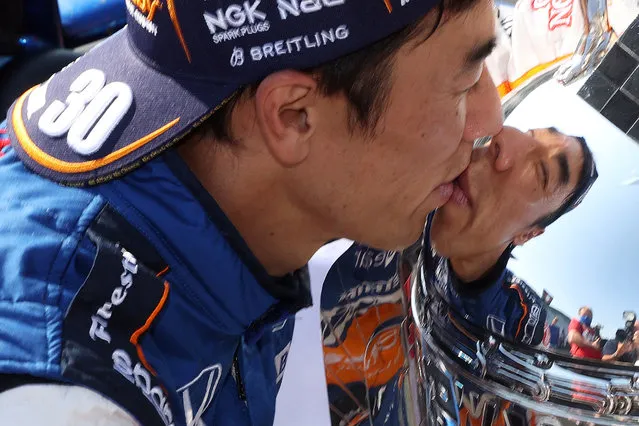 IndyCar driver Takuma Sato (30) kisses the Borg-Warner Trophy after winning the 2020 Indianapolis 500 at the Indianapolis Motor Speedway on August 24, 2020. (Photo by Brian Spurlock/USA TODAY Sports)