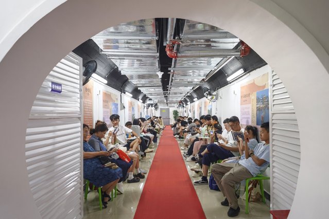 People enjoy the cool in an air-raid shelter on July 3, 2025 in Nanjing, Jiangsu Province of China. Nanjing has opened 22 air-raid shelters for local people to escape summer heat. (Photo by Yang Bo/China News Service/VCG via Getty Images)