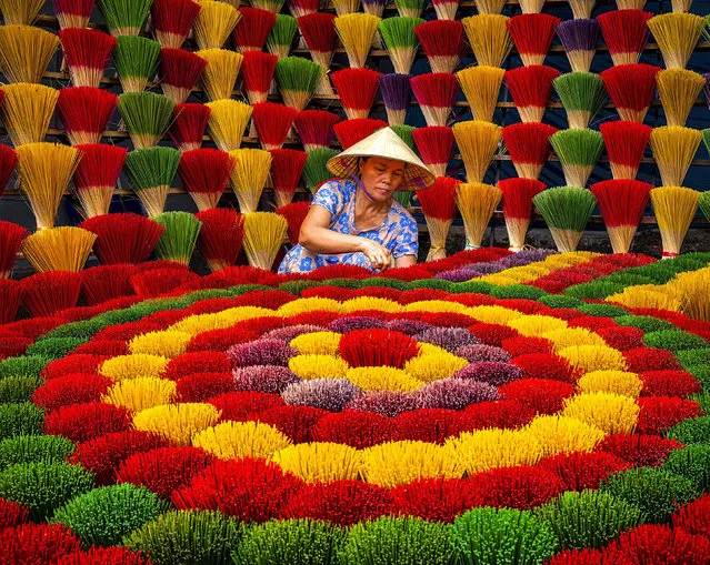 A colourful display of incense sticks at a factory near Hue, Vietnam early December 2022. (Photo by Hilton Chen/Solent News)