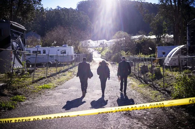 FBI officials walk towards the crime scene at Mountain Mushroom Farm, Tuesday, January 24, 2023, after a gunman killed several people at two agricultural businesses in Half Moon Bay, Calif.  Officers arrested a suspect in Monday’s shootings, 67-year-old Chunli Zhao, after they found him in his car in the parking lot of a sheriff’s substation, San Mateo County Sheriff Christina Corpus said.  (Photo by Aaron Kehoe/AP Photo)