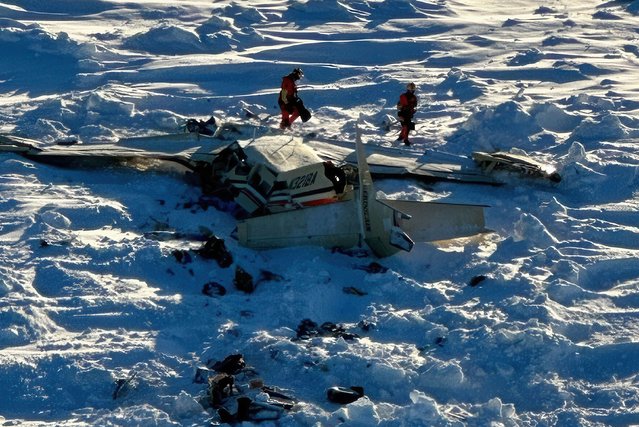This photo, provided by the US Coast Guard on Friday, February 7, 2025, shows a small commuter plane that crashed off the coast of western Alaska. Ten people were killed in the crash. (Photo by US Coast Guard/AP Photo)