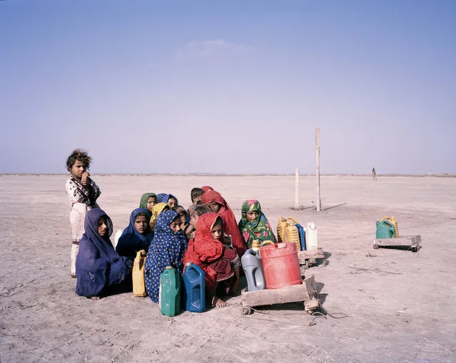 Children journey to collect water, Khado Muhammad Jut, Sindh, Pakistan, 2013. (Photo by Mustafah Abdulaziz/Water Aid)