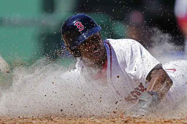Boston Red Sox Greg Allen scores as he slides into home plate in the fourth inning of a spring training baseball game in Fort Myers, Fla., Sunday, March 12, 2023. (Photo by Gerald Herbert/AP Photo)
