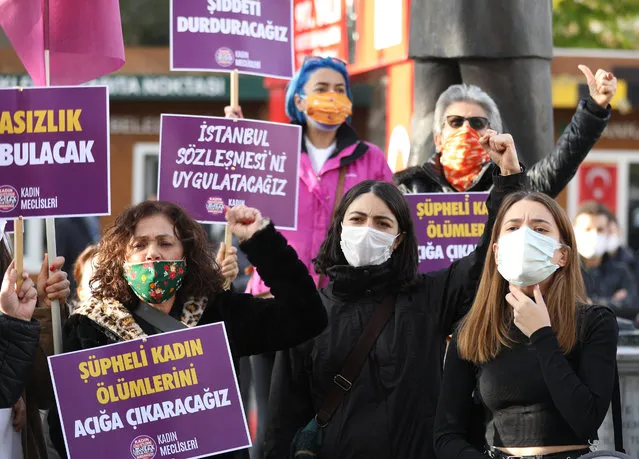 Members of KCDP (We Will Stop Femicides Platform – Kadin Cinayetlerini Durduracagiz Platformu) hold placards reading “stop femicide” and “We will enforce the Istanbul convention”, during a protest for a better implementation of the Istanbul Convention and the Turkish Law 6284 for protection of the family and prevention of violence against women, in Ankara on November 22, 2020. (Photo by Adem Altan/AFP Photo)