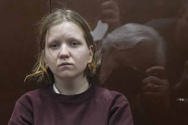 Darya Trepova, a 26-year-old St. Petersburg resident suspected of involvement in a bombing at a St. Petersburg cafe, sits in a cage in the courtroom prior to a court session in the Basmanny District Court, in Moscow, Russia, Tuesday, April 4, 2023. (Photo by Alexander Zemlianichenko/AP Photo)