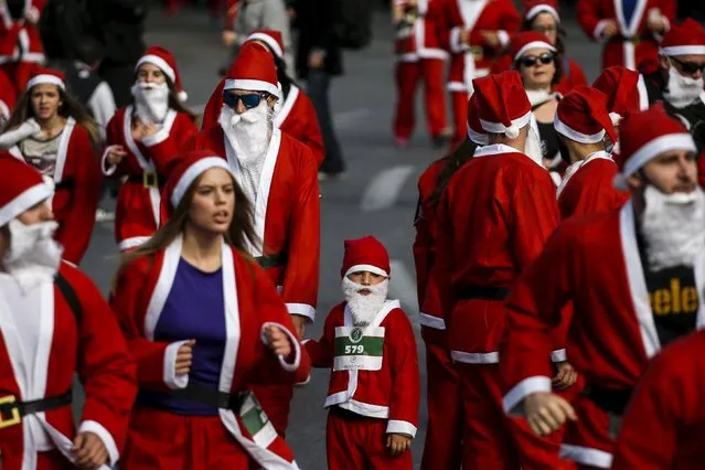 People dressed in Santa costumes take part in the Santa Claus Run in Athens, Greece, November 29, 2015. (Photo by Alkis Konstantinidis/Reuters)