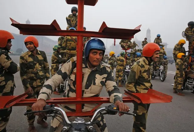 A Daredevil unit of the Indian Border Security Force prepares to perform during rehearsals for the upcoming Republic Day parade in New Delhi, India, Thursday, January 14, 2015. (Photo by Manish Swarup/AP Photo)