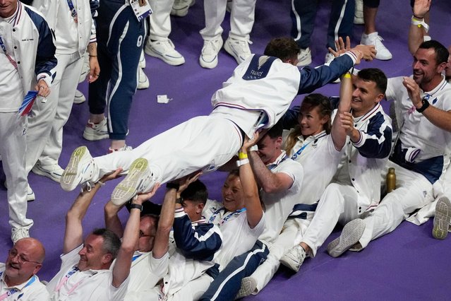 Athletes from the French team react during the 2024 Summer Olympics closing ceremony at the Stade de France, Sunday, August 11, 2024, in Saint-Denis, France. (Photo by Rebecca Blackwell/AP Photo)