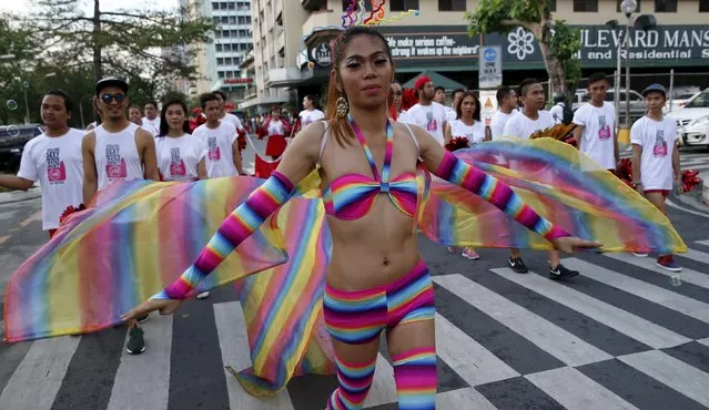 A Filipino transgender woman wears a rainbow colour LGBT-themed costume during a World Aids Day celebration in Manila, Philippines, December 1, 2015. (Photo by Erik De Castro/Reuters)