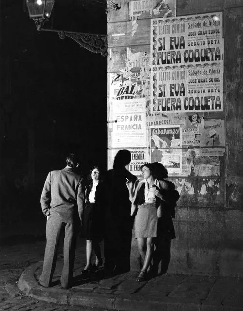 Two prostitutes talking to a client on a Barcelona street corner.  Original Publication: Picture Post - 5243 - Barcelona a City in Ferment - pub. 1951   (Photo by Bert Hardy/Getty Images)