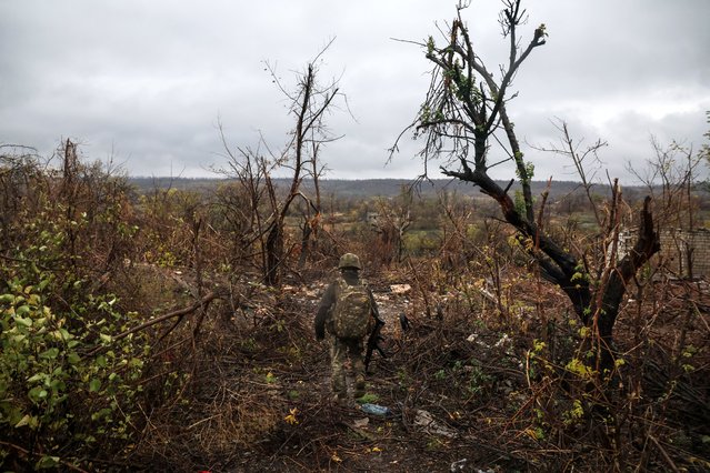 This handout photograph taken on October 25, 2025, and released on November 4, 2025, by the Press Service of the 24th Mechanized Brigade of Ukrainian Armed Forces shows a serviceman of a motorized infantry battalion walking at the front line position near the town of Chasiv Yar in the Donetsk region, amid the Russian invasion of Ukraine. (Photo by Handout/24th Mechanized Brigade of Ukrainian Armed Forces/AFP Photo)