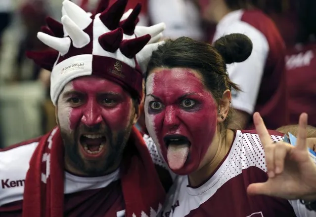 Two supporters of Qatar cheer their team before their round of 16 match against Austria during the 24th men's handball World Championship in Doha January 25, 2015. (Photo by Fadi Al-Assaad/Reuters)