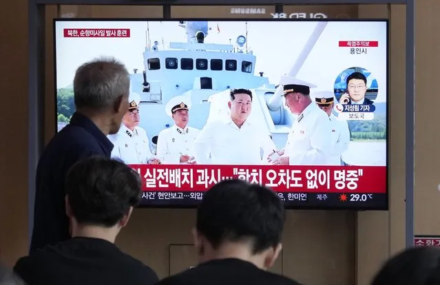 A TV screen shows an image of North Korean leader Kim Jong Un, second from right, during a news program at the Seoul Railway Station in Seoul, South Korea, Monday, August 21, 2023. North Korean leader Kim has observed the test-firing of strategic cruise missiles from a navy ship, state media reported Monday, as the U.S. and South Korean militaries kicked off major annual drills that the North views as an invasion rehearsal. (Photo by Ahn Young-joon/AP Photo)