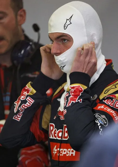 Toro Rosso Formula One driver Max Verstappen of the Netherlands puts on his balaclava during the second practice session of the Australian F1 Grand Prix at the Albert Park circuit in Melbourne March 13, 2015.    REUTERS/Brandon Malone