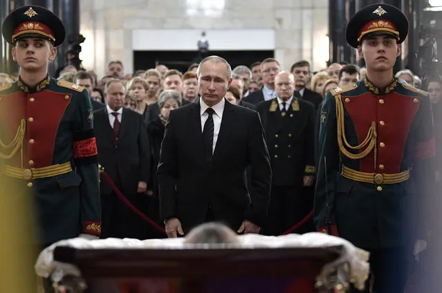 Russian President Vladimir Putin, center, attends a farewell ceremony for the Russian Ambassador to Turkey Andrei Karlov at the Foreign Ministry headquarters in Moscow, Russia, Thursday, December 22, 2016. Karlov was fatally shot by a Turkish policeman Monday in a gathering in Ankara, Turkey. (Photo by Alexei Nikolsky/Sputnik, Kremlin Pool Photo via AP Photo)
