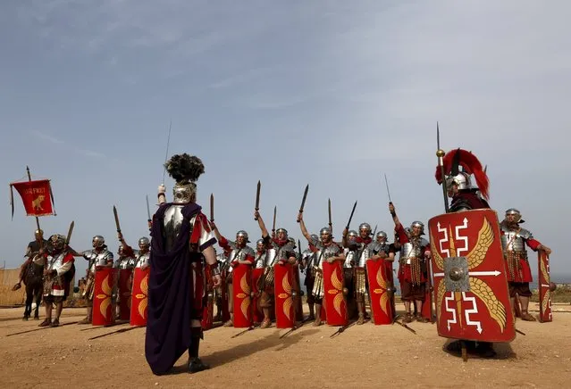 Members of the Legio X Fretensis (Malta) re-enactment group take part in a display of ancient Roman army life at Fort Rinella in Kalkara, outside Valletta, March 22, 2015. (Photo by Darrin Zammit Lupi/Reuters)