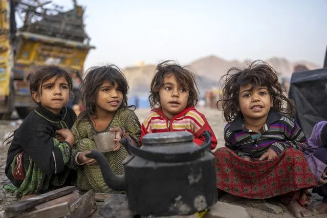 Afghan refugees settle in a camp near the Torkham Pakistan-Afghanistan border in Torkham, Afghanistan, Saturday, November 4, 2023. A huge number of Afghans refugees entered the Torkham border to return home hours before the expiration of a Pakistani government deadline for those who are in the country illegally to leave or face deportation. (Photo by Ebrahim Noroozi/AP Photo)