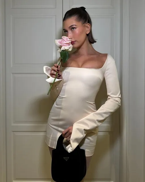 American model Hailey Bieber early December 2023 stops to smell the roses. (Photo by Hailleybieber/Instagram)
