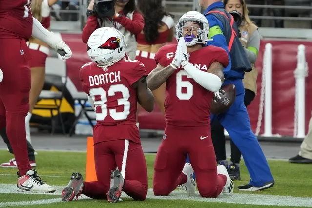 Arizona Cardinals running back James Conner (6) celebrates with Greg Dortch (83) after Conner scored a touchdown against the Seattle Seahawks in the second half of an NFL football game Sunday, January 7, 2024, in Glendale, Ariz. (Photo by Rick Scuteri/AP Photo)