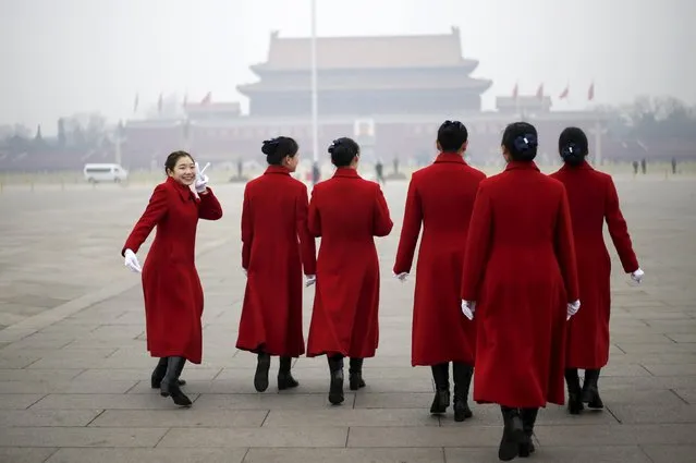 Hostesses walk at Tiananmen Square near the Great Hall of the People where meetings take place ahead of tomorrow's opening ceremony of the National People's Congress (NPC) in Beijing, China March 4, 2016. (Photo by Jason Lee/Reuters)