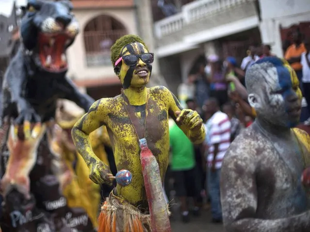 A man with his body painted attends Carnival celebrations in Jacmel, Haiti, Sunday, February 23, 2014. The city of Jacmel is known for its arts to kick off Haiti’s pre-Lent festival. (Photo by Dieu Nalio Chery/AP Photo)