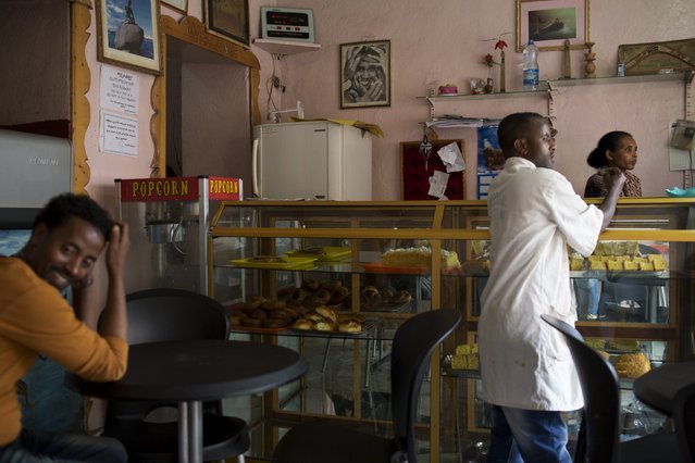 A waiter stands in a coffee shop in the old walled town of Harar in eastern Ethiopia, May 20, 2015. (Photo by Siegfried Modola/Reuters)
