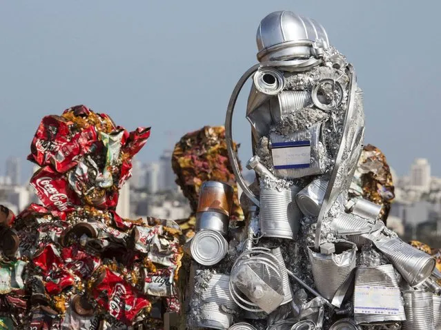 Sculptures made of waste material titled “Trash People” by German Artist Ha Schult in Ariel Sharon Park, in the suburbs of Tel Aviv. (Photo by Jack Guez/AFP Photo)
