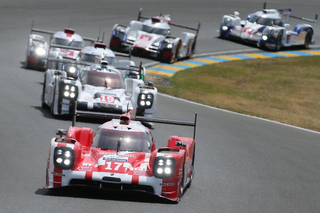 The Porsche 919 Hybrid No17 of the Porsche Team driven by Timo Bernhard of Germany is seen in action during the 83rd 24-hour Le Mans endurance race, in Le Mans, western France, Saturday, June 13, 2015. (AP Photo/David Vincent)