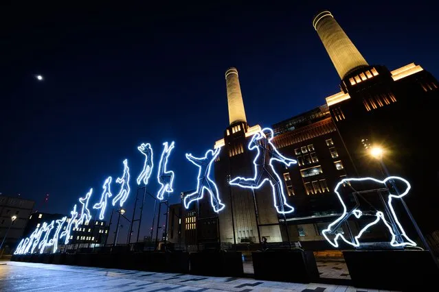 A light installation called “Run Beyond” by Angelo Bonello is seen on the launch day of the Light Festival at Battersea Power station on January 13, 2022 in London, England. Running from January 13 to February 27, the curated collection of installations includes work by six artists, with two displays making their UK exhibition debut. (Photo by Leon Neal/Getty Images)