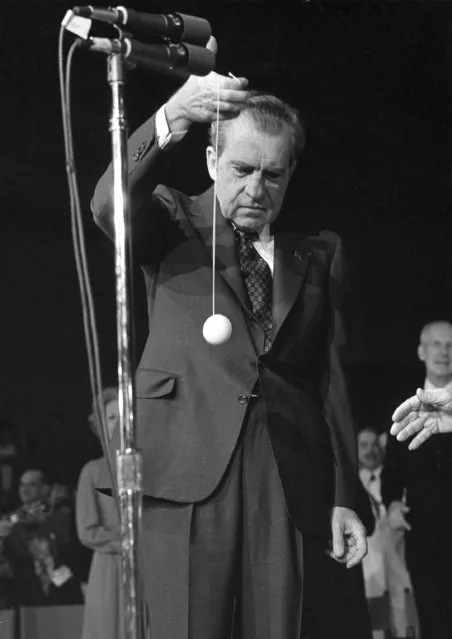 President Nixon has trouble working a yo-yo which was given to him by country singer Roy Acuff during his visit to a performance at the Grand Ole Opry in Nashville, Tenn., March 17, 1974. (Photo by AP Photo)