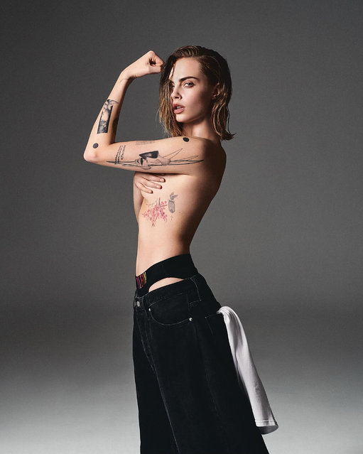 In another pic Cara flexed as she showed off her impressive tattoo collection. (Photo by Calvin Klein)