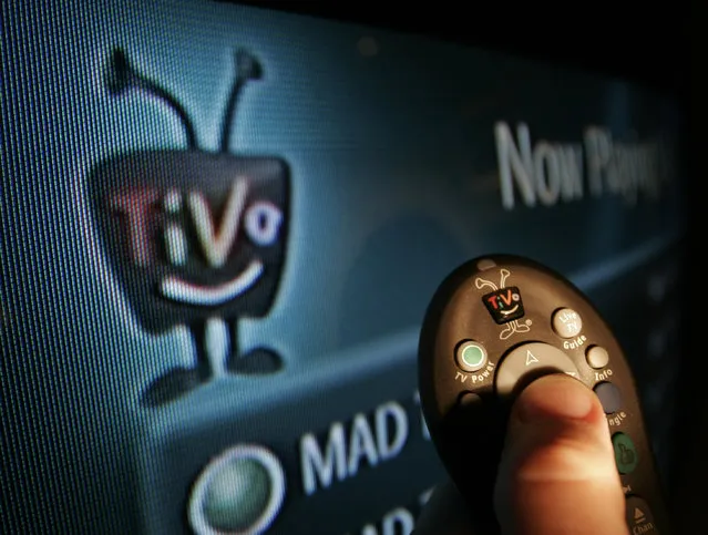 A TiVo remote control is the tool that television watchers are armed with to access the digital technology that allows them to pause, replay or fast-forward live programming Monday, November 29, 2005 in Kansas City, MO. TiVo is expected to report a loss of 24 cents per share on revenue of $42 million for the quarter ended in October, according to Thomson Financial. (Photo by Cliff Schiappa/AP Photo)