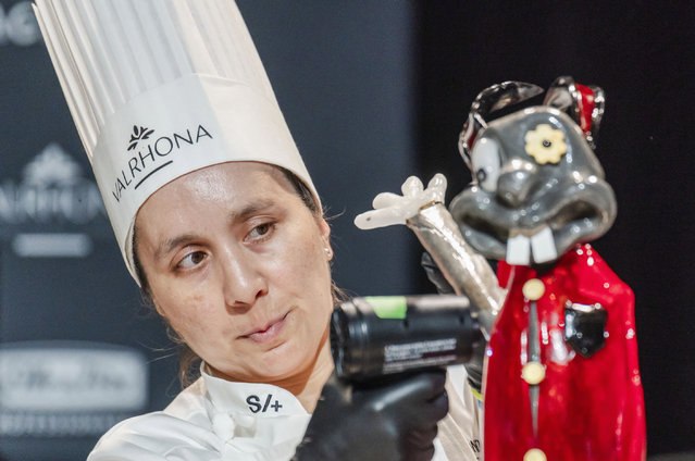 Nadia Castillo, of Chile, adds an arm to her display during the Coupe de Monde de la Patisserie, or World Pastry Cup, at the Ernest N. Morial Convention Center in New Orleans, Tuesday, June 11, 2024. (Photo by Matthew Perschall/The Times-Picayune/The New Orleans Advocate via AP Photo)