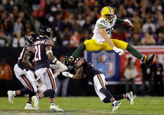 Green Bay Packers tight end Jimmy Graham hurdles Chicago Bears free safety Eddie Jackson in front of Bears inside linebacker Danny Trevathan and Bears strong safety Ha Ha Clinton-Dix in the second quarter at Soldier Field in Chicago, Illinois, September 5, 2019. (Photo by Mike De Sisti/Milwaukee Journal Sentinel via USA TODAY Sports)