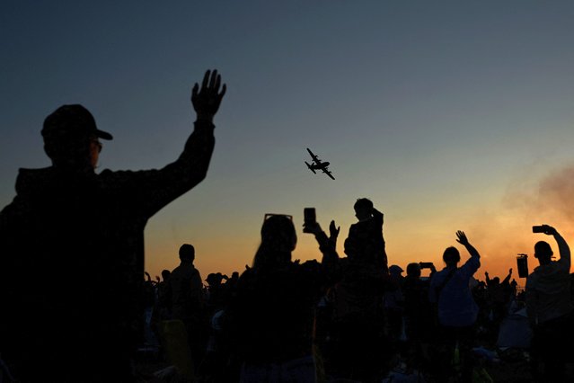 Spectators greet C-130 Hercules aircraft of the Polish Air Force during the Antidotum airshow in Leszno, Greater Poland region, on June 22, 2024. (Photo by Sergei Gapon/AFP Photo)