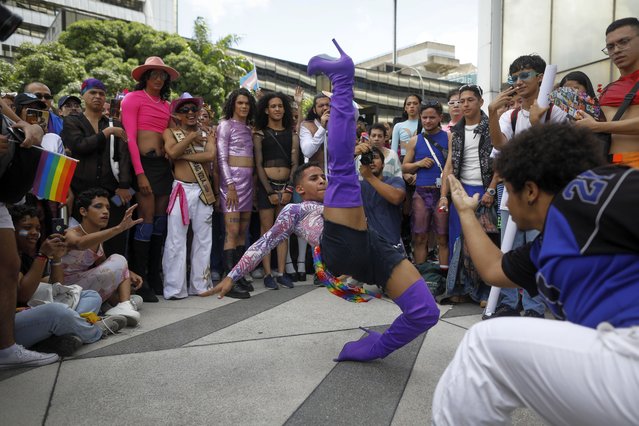 A reveler performs during a dance battle in a Gay Pride march in Caracas, Venezuela, Sunday, July 7, 2024. (Photo by Cristian Hernandez/AP Photo)