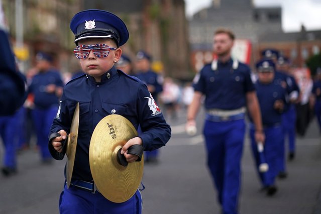 People take part in an Orange Order parade in Belfast as part of the “Twelfth of July” celebrations on Friday, July 12, 2024. (Photo by Brian Lawless/PA Images via Getty Images)