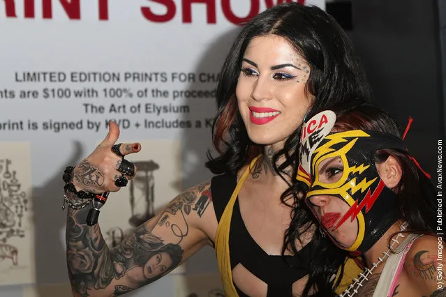 A Sephora client poses with Kat Von D at Kat Von D's first solo art show 'New American Beauty' at Sephora Antara store