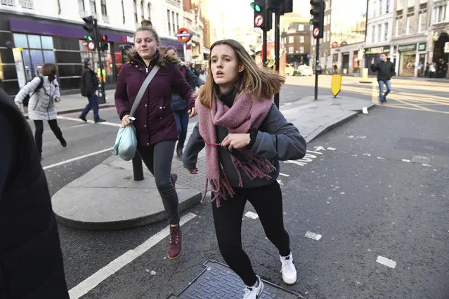 People are evacuated from London Bridge in central London following a police incident, Friday, November 29, 2019. British police said Friday they were dealing with an incident on London Bridge, and witnesses have reported hearing gunshots. The Metropolitan Police force tweeted that officers were “in the early stages of dealing with an incident at London Bridge”. (Photo by Dominic Lipinski/PA Wire via AP Photo)