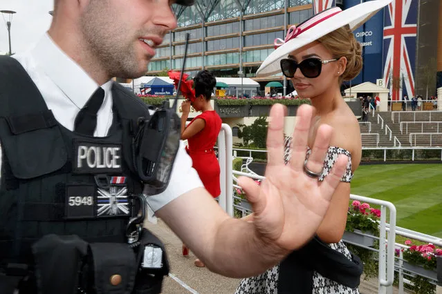 A policeman and a model have their photograph taken before racing on the third day of Royal Ascot at Ascot Racecourse on June 22, 2017 in Ascot, England. (Photo by Tom Jenkins/The Guardian)