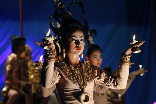 Cambodian Royal Fine Art University students perform the traditional drama, called “Lakhoan Yike” in Phnom Penh, Cambodia, Wednesday, August 5, 2015. The drama tells a historical narrative. (Photo by Heng Sinith/AP Photo)