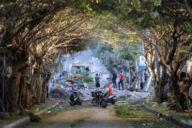 Residents inspect the destruction follwing Israeli airstrikes on the Mreijeh neighbourhood in Beirut's southern suburbs on October 4, 2024. (Photo by AFP Photo/Stringer)