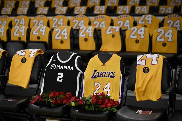 The jerseys of late Los Angeles Laker Kobe Bryant, right, and his daughter Gianna are draped on the seats the two last sat on at Staples Center, prior to the Lakers' NBA basketball game against the Portland Trail Blazers in Los Angeles, Friday, January 31, 2020. The last game two attended was on Dec. 29, 2019 when the Lakers faced the Dallas Mavericks. (Photo by Kelvin Kuo/AP Photo)